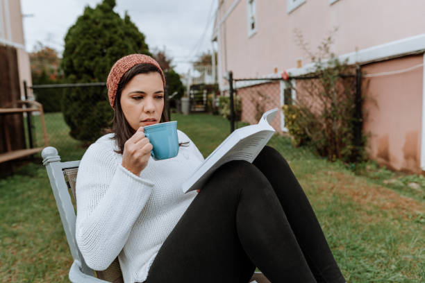 istock Woman relaxing reading a book 1283094991