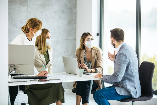istock Group of business people brainstorming inside modern office 1283095655