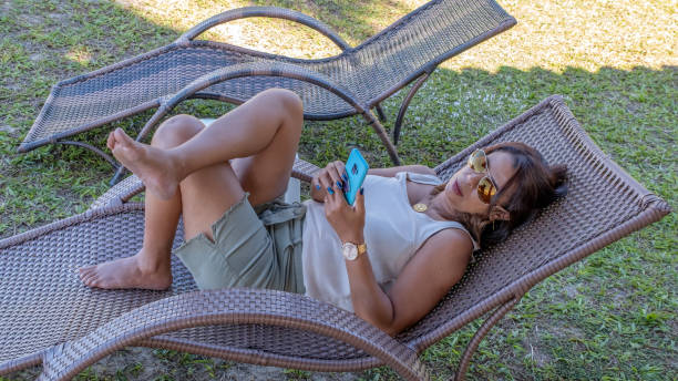 istock Brazilian woman relaxing on a deck chair 1283095680