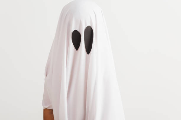 istock little cute child with white dressed costume halloween ghost scary 1283098391