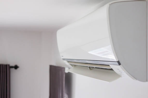 istock Air conditioner on white wall room interior background 1283099211