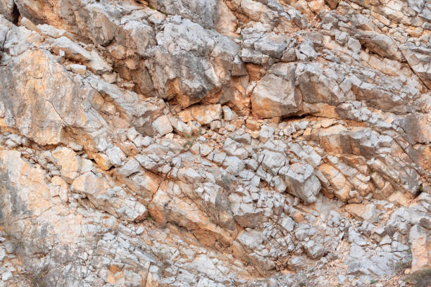 istock Seamless rock texture background orange hillside warm sunny contrast clean sharp focus 1283099636