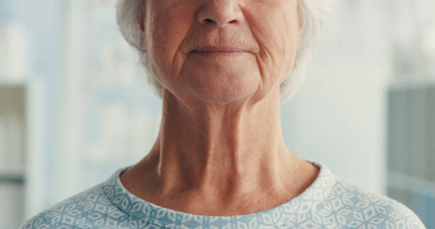 I've never been more serious about my health than now Shot of a senior woman wearing a hospital gown in a hospital neck stock pictures, royalty-free photos & images