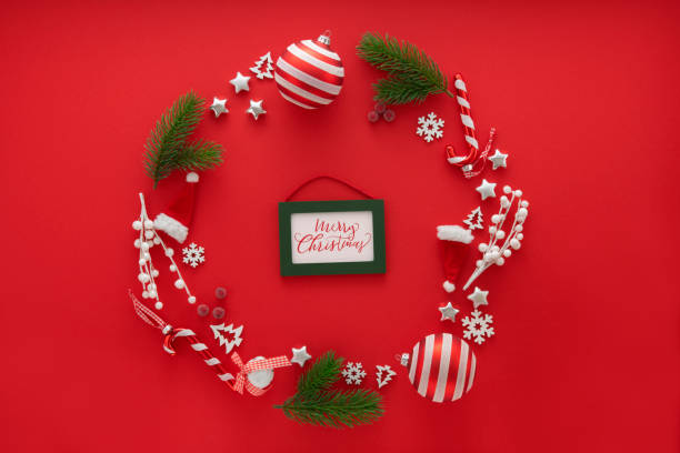 istock Christmas Decoration on red background and a greeting card 1283106085