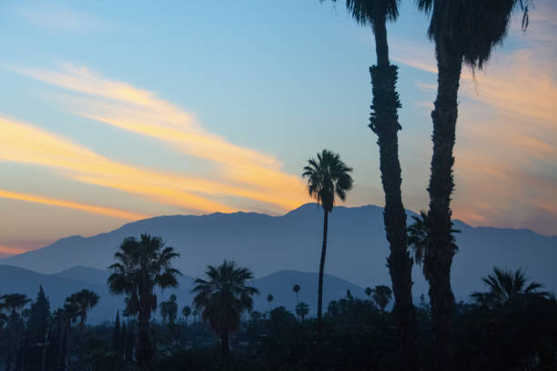 istock Sunset over the Mountains with palm trees-Riverside, California 1283107574