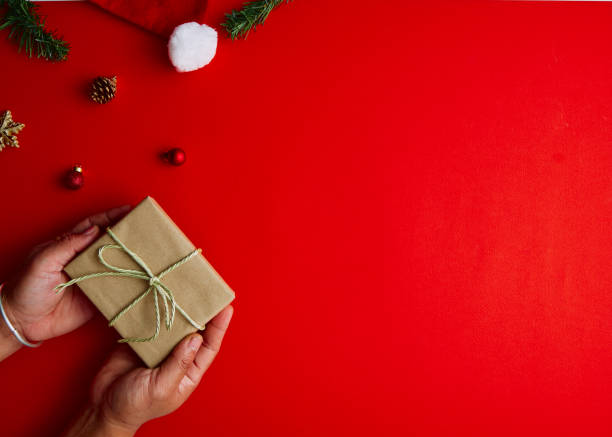 istock Flat lay Creative composition of Man holding Christmas gift box 1283108255