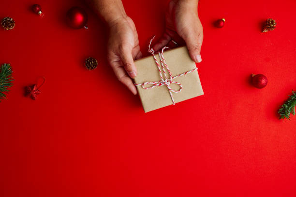 istock Flat lay Creative composition of Man holding Christmas gift box 1283108261