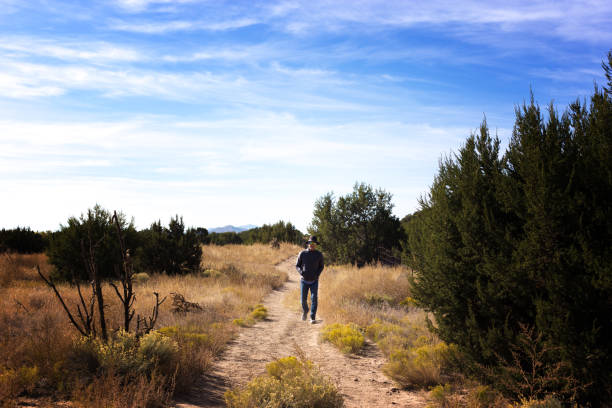 istock Santa Fe, NM: Hiker at La Cieneguilla Petroglyph Site 1283110223