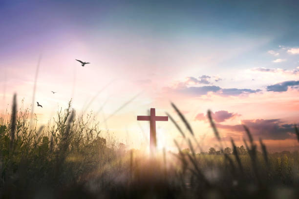 istock Religious cross concept: Silhouette cross on mountain at sunset background 1283110992