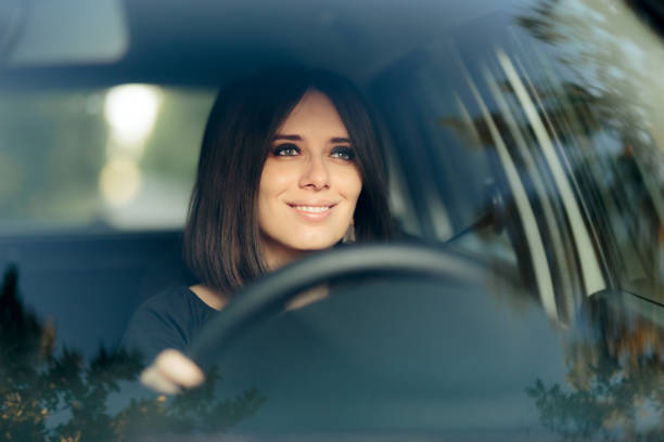 istock Happy Female Driver with Eyes on the Road 1283111043