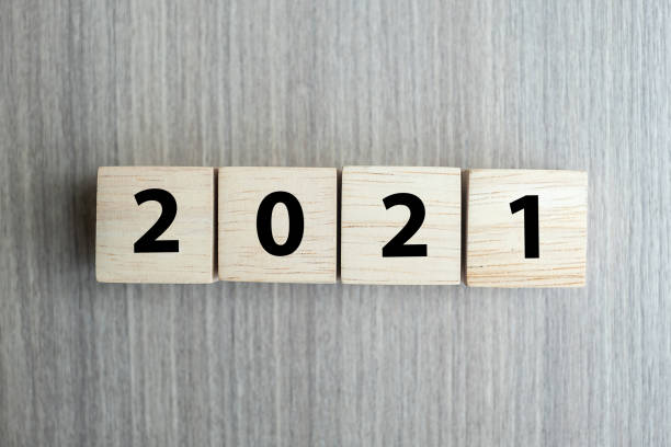 istock 2021 new year wooden cube blocks on table background with copy space for text. Business Goals, Mission, Resolution, New Year New You concept 1283111649