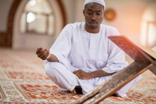 istock Religious black Muslim man praying inside the mosque 1283113113