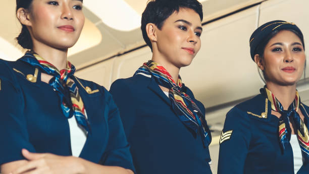 istock Cabin crew dancing with joy in airplane 1283116159