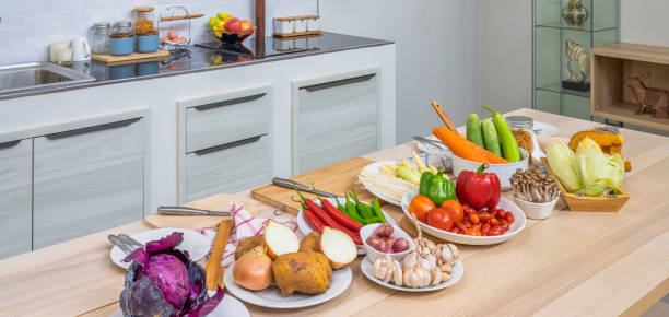 istock Fresh vegetable and fruit on wooden table in kitchen 1283116908