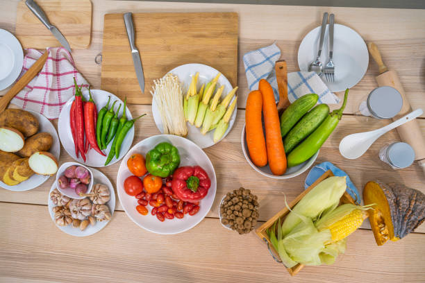 istock Fresh vegetable and fruit on wooden table in kitchen 1283117614