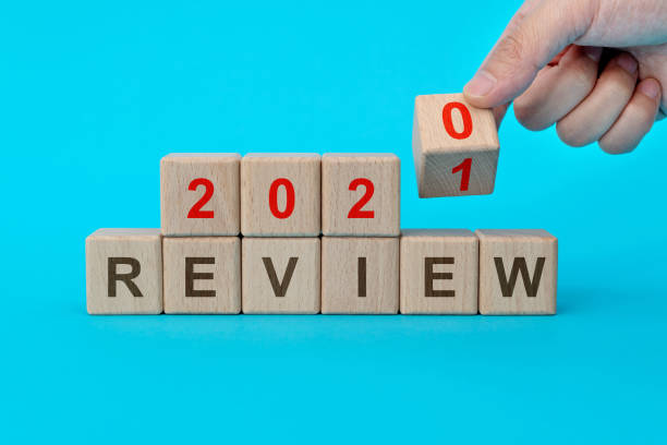 2021 review text on wooden blocks