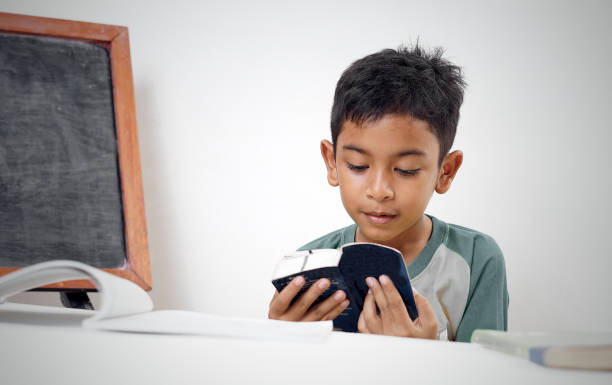 istock Little Boy doing his study and homework at bedroom 1283123921