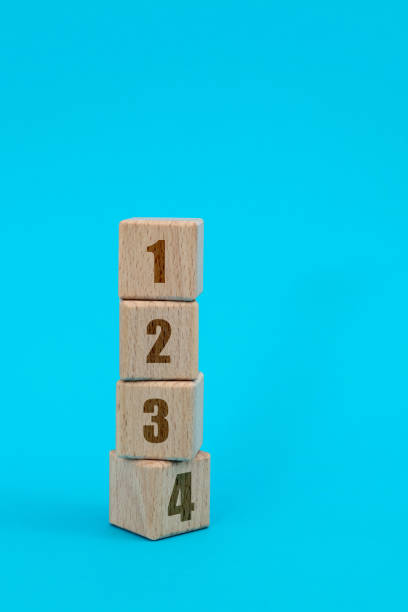 istock Wooden number blocks 1234 on blue background 1283123997