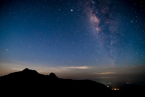 Amazing stary night above the mountain range in Doi Luang National Park, Payao, Thailand.