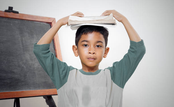 istock Little Boy doing his study and homework at bedroom 1283124183