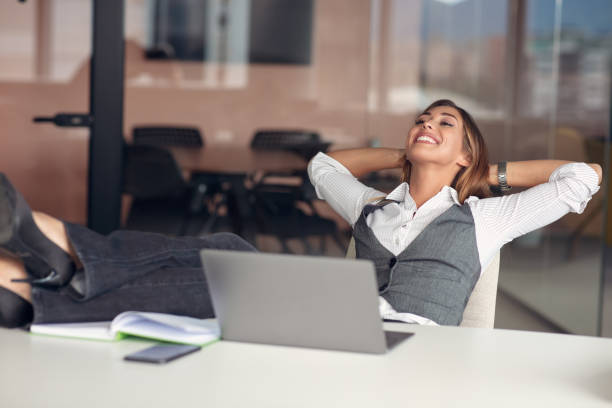 istock Modern business woman in the office working at computer 1283125058