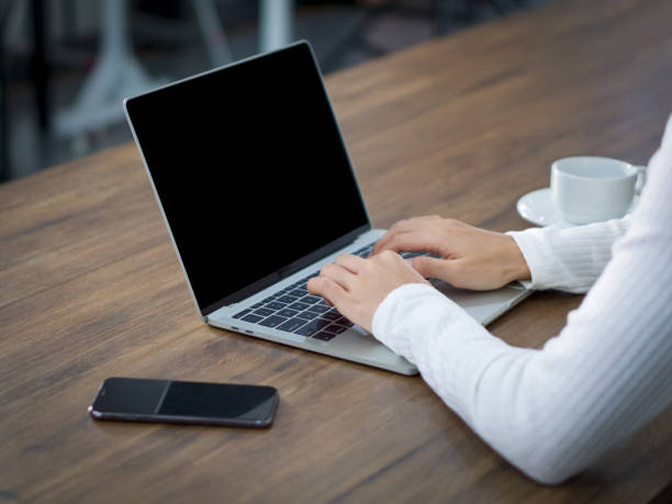 istock Young woman use her finger press on keyboard to waking computer from sleep mode. 1283125913