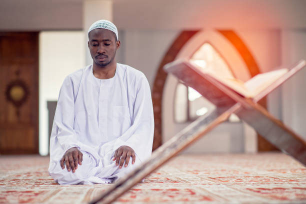 istock Religious black Muslim man praying inside the mosque 1283126773