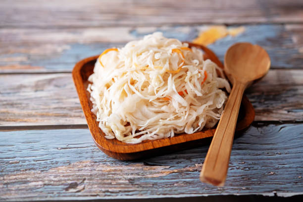 istock Fresh raw pickled cabbage with casrrot in a white bowl 1283127457