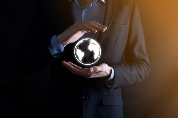istock Businessman with protective gesture standing posture hand holding Earth icon , digital globe 1283127867