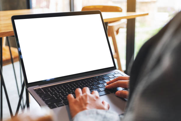 istock a woman using and typing on laptop computer with blank white desktop screen 1283128459