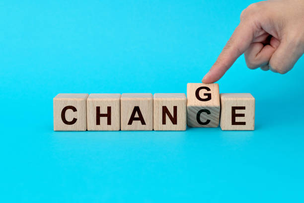 Wooden cubes with word change and chance.
