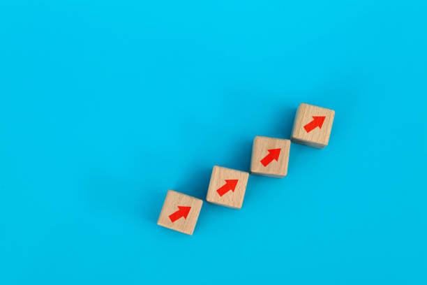 istock Wooden blocks with arrow up 1283130865