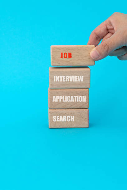 istock Words job, interview, application, search on toy blocks 1283130933