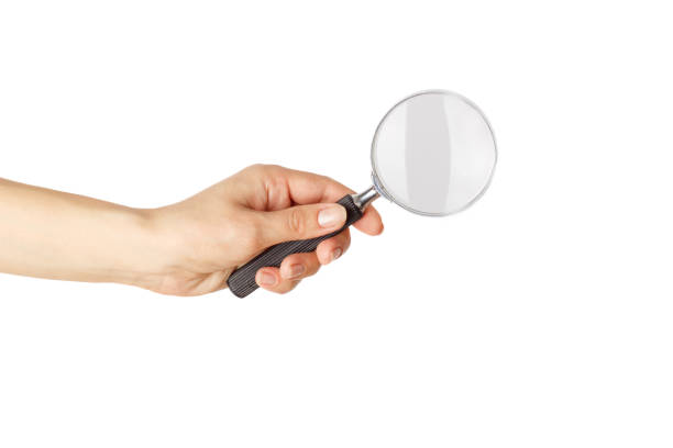 istock Magnifying glass in the hand, isolated 1283131990