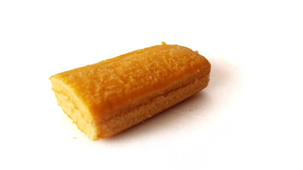 istock Tea flavoured cake with white cream on white background. 1283145814