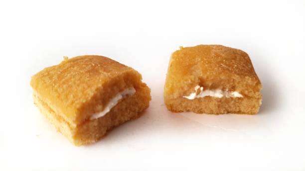 istock Tea flavoured cake with white cream on white background. 1283145822
