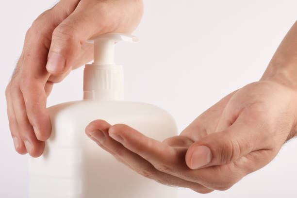 istock Men's hand using disinfection, hand disinfection on the white background with copy space 1283146381