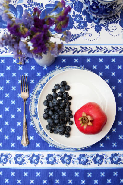 Red pomegranate on a plate.