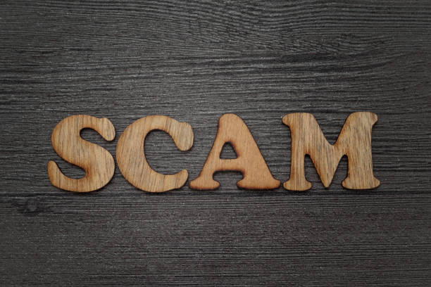 istock scam text word concept, wooden lettering alphabet over grunge background 1283147119