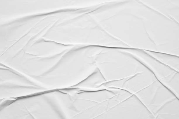 istock Blank white crumpled and creased paper poster texture background 1283150167