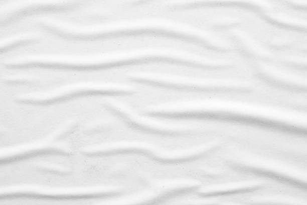 istock Blank white crumpled and creased paper poster texture background 1283150170