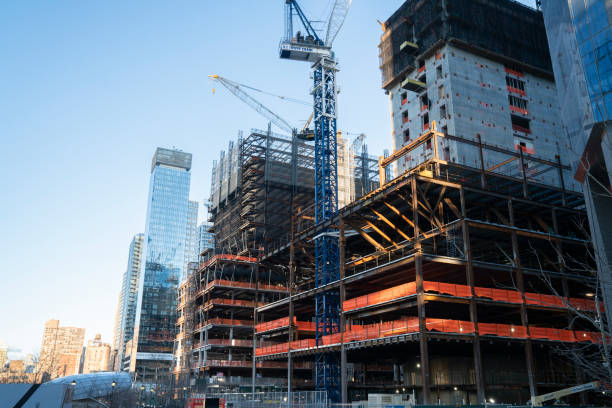istock Tall buildings under construction and cranes in New York City 1283154331