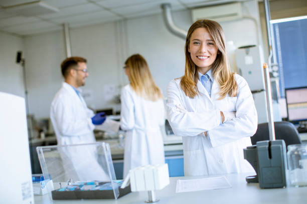 istock Female scientist in white lab coat standing in the biomedical lab 1283155755