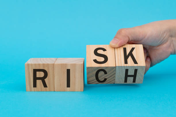 istock Wooden blocks with word risk and rich 1283156685