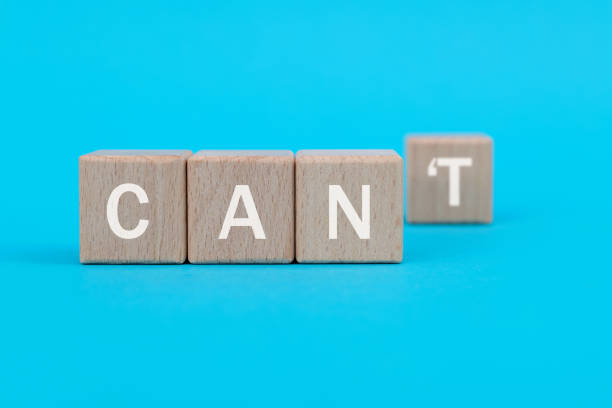 istock Wooden blocks with word can and can't 1283157814