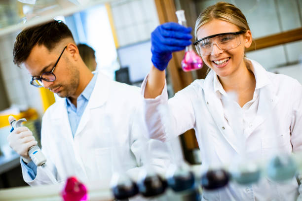 istock Young female scientist examining liquid in biochemical lab 1283158037