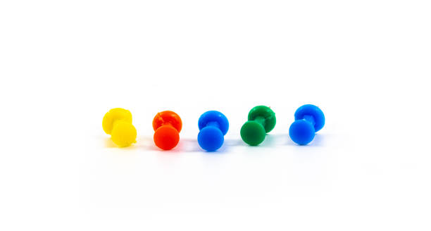 istock Several multicolored pins, macro photo on white isolated background 1283158363