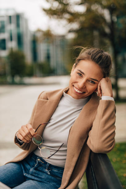 istock Smiling with teeth, sitting on the bench. 1283161244