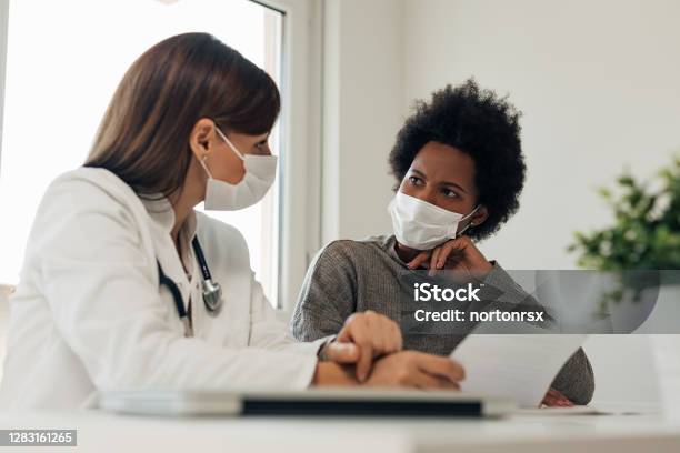 Talking About Patients Diagnosis Stock Photo - Download Image Now - Doctor, Patient, Mask - Disguise