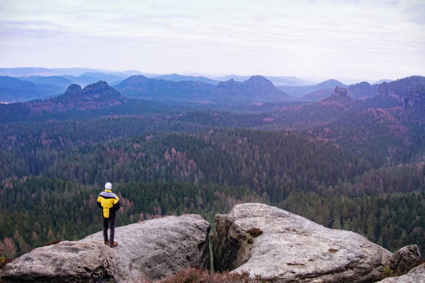 istock Lone hiker enjoying the view over the beautiful landscape 1283162364